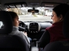 Elizabeth and Linda Stone face off after accidentally running a stop sign during a practice driving session in their neighborhood. Elizabeth wears a prosthetic leg to walk and drive. 
