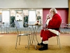 Ben Baird, dressed as Santa Claus, enjoys a coffee at Janies Cookies at Centerpointe Mall in Grand Rapids before beginning his shift. Baird has been dressing as Santa for 30 years at malls and schools, but will be retiring as Santa at Centerpointe after this year.