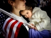 Azeneth Rangel, 2, of Wyoming rests on her aunt Maria Rangel\'s shoulder during a rally for immigration rights at Calder Plaza in Grand Rapids. Azeneth\'s family moved to the United States 18 years ago from Guanajuato, Mexico.