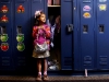 Olivia Helms, 6, of Grandville clutches a shiny new purse outside her locker at Zion Christian Elementary before class. Olivia was surprised with the purse when an anonymous giver left it for her at the counter at Marshall\'s on Tuesday, September 2. Oivia\'s mom, Kristen explains the woman had asked Olivia to help her pick out the purse for her granddaughter, but then left it at the counter for Olivia. \