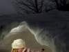 Sydney Riffle, 7, of Belding gets cozy inside a snow cave Saturday at the John Ball Park Zoo during Winterfest 08. Ice sculptures, snow shoeing and behind-the scenes tours were a few of the options for families to take part in during the free event.