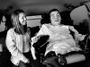 Lovell jokes with Hoffman in their van after traveling to Mary Free Bed Hospital for speech therapy. \